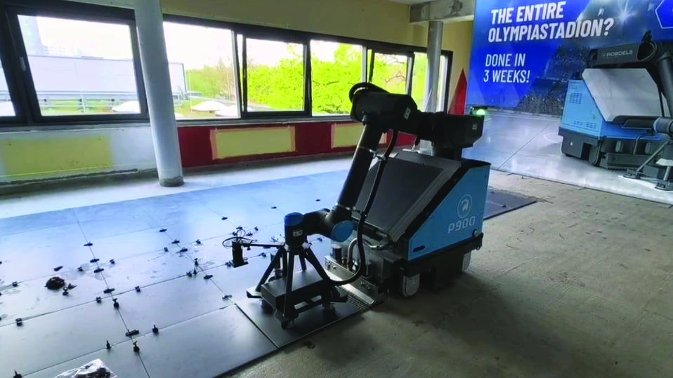 Floor tiling robot working inside a commercial building in Berlin